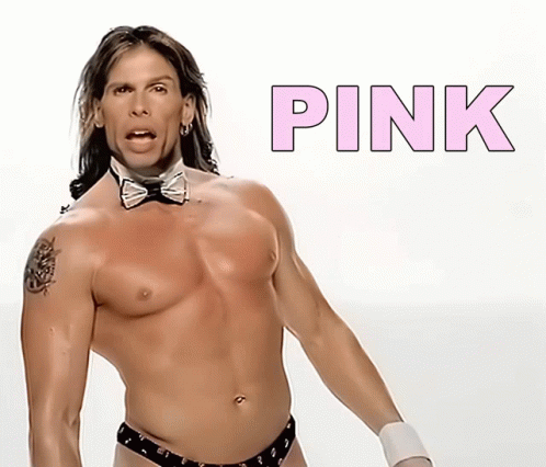 A Shirtless Man In A Bow Tie Is Standing In Front Of A Pink Sign GIF