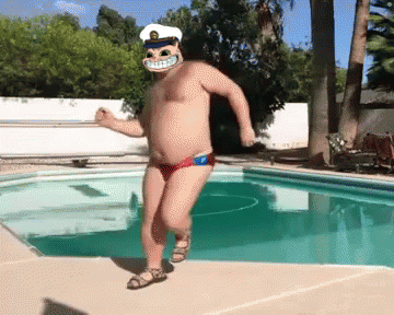 A Shirtless Man In A Captain 'S Hat Is Dancing Near A Pool GIF