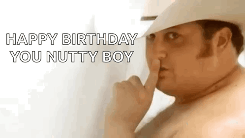 A Shirtless Man In A Cowboy Hat Is Making A Shhh Gesture . GIF