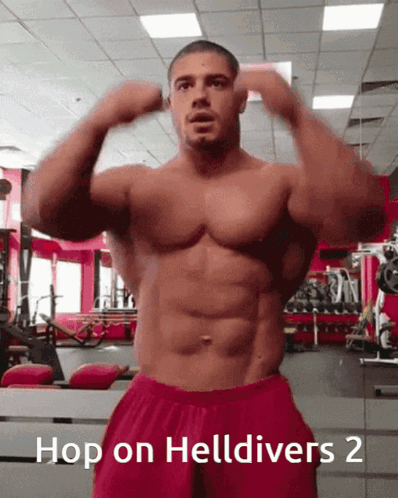 A Shirtless Man In A Gym With The Words Hop On Helldivers 2 Below Him GIF