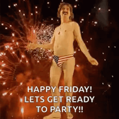 A Shirtless Man In An American Flag Swim Suit Is Dancing In Front Of Fireworks . GIF