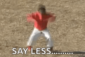 A Shirtless Man In Underwear Is Standing In A Field With His Arms Outstretched . GIF