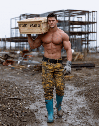 a shirtless man is carrying a box of stud parts