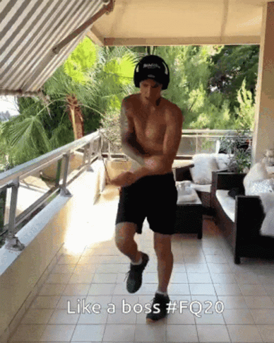 A Shirtless Man Is Dancing On A Balcony With The Caption Like A Boss GIF