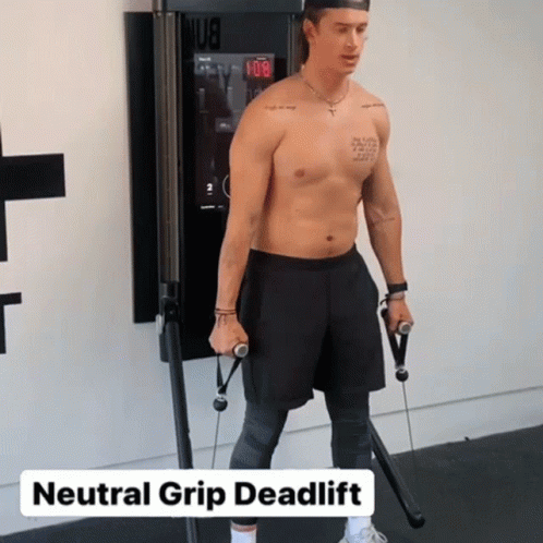 A Shirtless Man Is Doing A Neutral Grip Deadlift On A Machine GIF