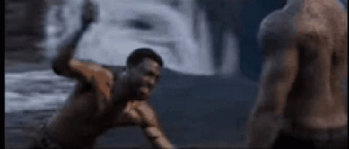 A Shirtless Man Is Fighting Another Shirtless Man In A Video Game . GIF