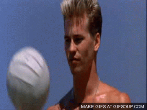 A Shirtless Man Is Holding A Volleyball In His Hand With A Make Gifs At Gifsoup.com Watermark Above His Head GIF