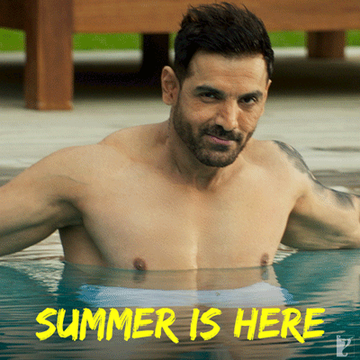 A Shirtless Man Is In A Pool With The Words Summer Is Here GIF