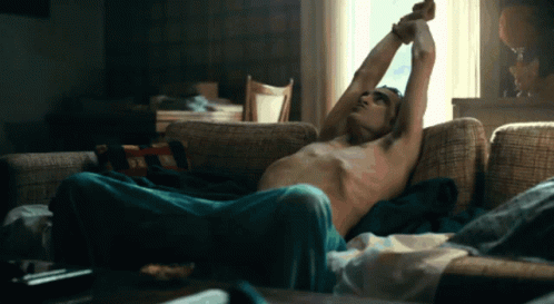 Shirtless Man Lying On Couch GIF