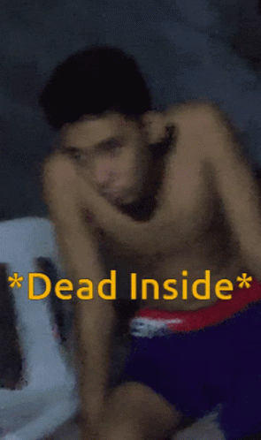 A Shirtless Man Is Sitting In A Chair With The Words Dead Inside Written Above Him GIF