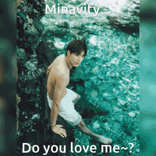 A Shirtless Man Is Sitting On A Rock In The Water With The Words Minavity Do You Love Me GIF