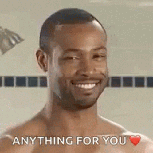 A Shirtless Man Is Smiling And Saying `` Anything For You '' In A Shower . GIF
