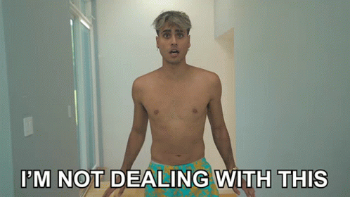 A Shirtless Man Is Standing In A Hallway With The Words I 'M Not Dealing With This Behind Him GIF