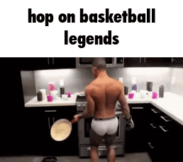 A Shirtless Man Is Standing In A Kitchen Holding A Pan And A Pancake . GIF
