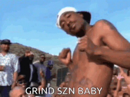 A Shirtless Man Is Standing In Front Of A Crowd With The Words Grind Szn Baby Written On The Bottom GIF