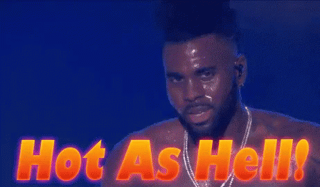 a shirtless man is standing in front of a sign that reads hot as hell