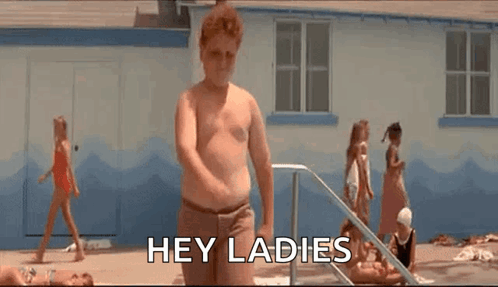 A Shirtless Man Is Standing In Front Of A Swimming Pool And Says `` Hey Ladies '' . GIF