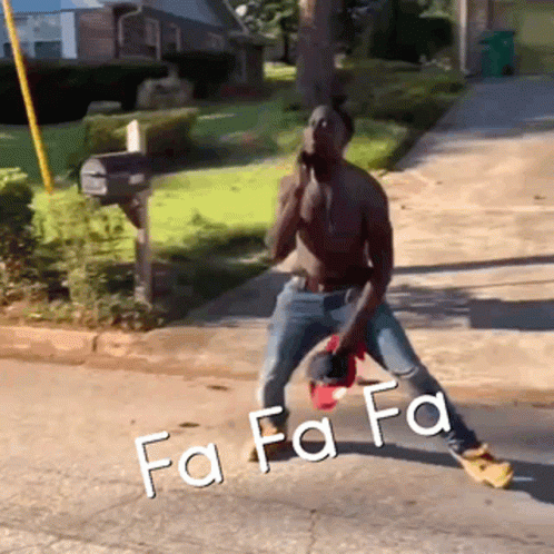 A Shirtless Man Is Standing On A Sidewalk With The Words Fa Fa Fa Written On The Ground GIF