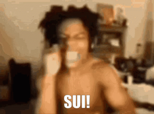 A Shirtless Man Is Talking On A Cell Phone And The Word Sui Is On The Bottom Right GIF