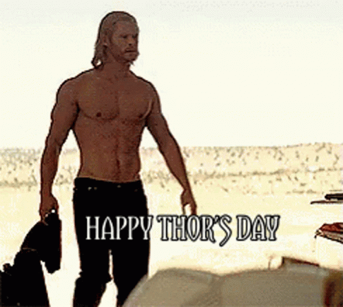 A Shirtless Man Is Walking On A Beach With The Words Happy Thor 'S Day Written Below Him GIF