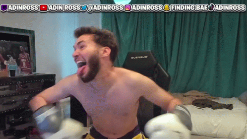 A Shirtless Man Is Wearing Boxing Gloves In Front Of A Screen That Says Adinross GIF