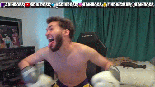 A Shirtless Man Is Wearing Boxing Gloves In Front Of A Screen That Says Finding Bae GIF