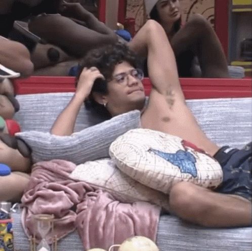Shirtless Man Laying On Couch With A Pillow GIF