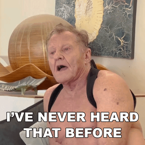 A Shirtless Man Says " I 'Ve Never Heard That Before " In Front Of A Painting GIF