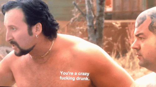 A Shirtless Man Says " You 'Re A Crazy Fucking Drunk " Next To Another Shirtless Man GIF