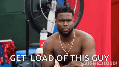 A Shirtless Man Sitting In Front Of A Fan With The Words Get Load Of This Guy Laugh Out Loud GIF