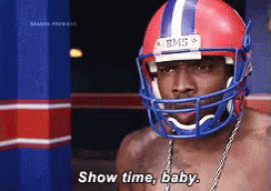 A Shirtless Man Wearing A Football Helmet Says " Show Time Baby " GIF