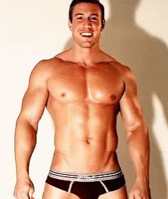 A Shirtless Man Wearing A Pair Of Briefs With The Word Briefs On The Front GIF