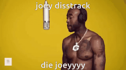 A Shirtless Man Wearing Headphones Stands In Front Of A Microphone With The Words Joey Disstrack Die Joeyyyy GIF