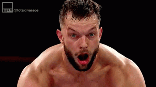 A Shirtless Man With A Beard Is Making A Funny Face With His Mouth Open . GIF