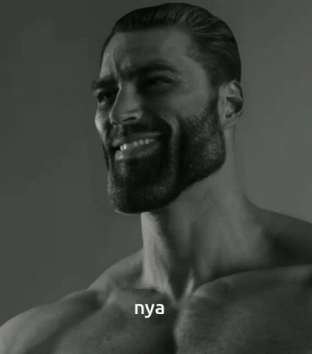 A Shirtless Man With A Beard Is Smiling And The Word Nya Is On His Chest GIF