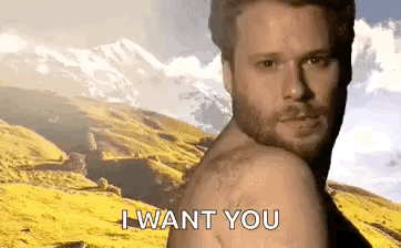 A Shirtless Man With A Beard Is Standing In Front Of A Mountain And Says `` I Want You '' . GIF