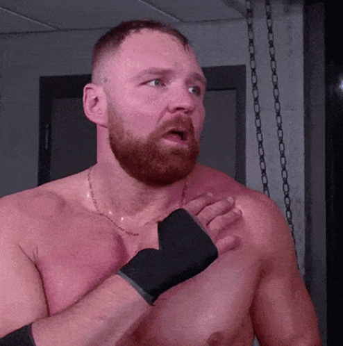 A Shirtless Man With A Beard Is Wearing Boxing Gloves On His Hands GIF