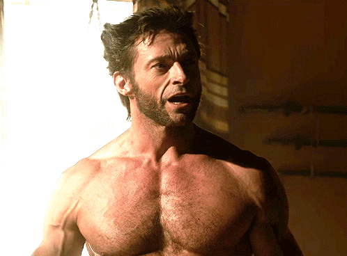 A Shirtless Man With A Beard Looks At The Camera With His Mouth Open GIF