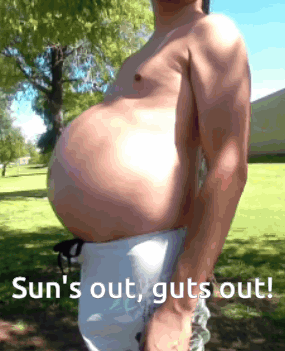 A Shirtless Man With A Large Belly Is Standing In A Park With The Words Sun 'S Out Guts Out GIF