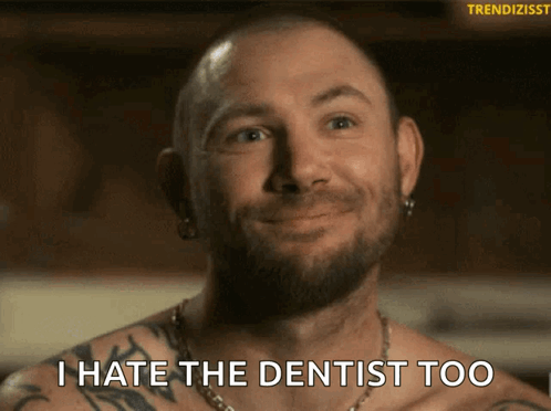 A Shirtless Man With A Tattoo On His Arm Says I Hate The Dentist Too GIF