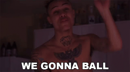 a shirtless man with a tattoo on his chest says " we gonna ball "