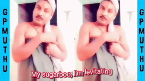 A Shirtless Man With A Towel Around His Head Is Standing In Front Of A Door . GIF