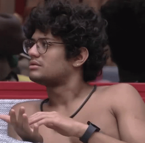 Shirtless Man With Curly Hair Glasses And Watch GIF