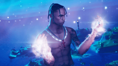 A Shirtless Man With Dreadlocks And A Necklace With A Cross On It GIF