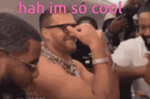 A Shirtless Man With Glasses And A Chain Around His Neck Says ' Hah Im So Cool ' In Pink GIF