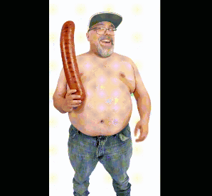A Shirtless Man With Glasses And A Hat Is Holding A Long Sausage GIF