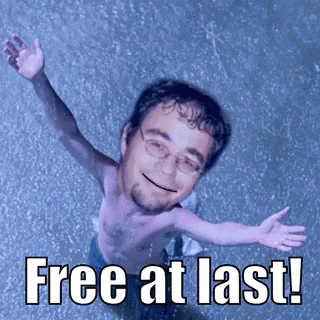 A Shirtless Man With His Arms Outstretched And The Words Free At Last Written Below Him GIF