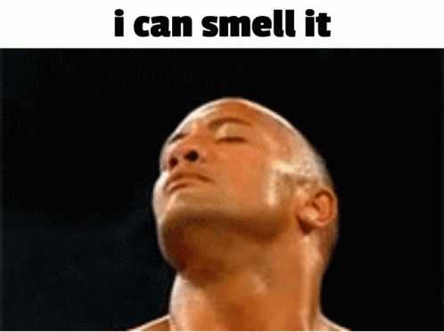 A Shirtless Man With His Eyes Closed And The Words " I Can Smell It " Below Him GIF