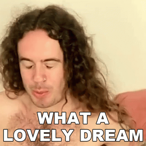 A Shirtless Man With Long Curly Hair Is Saying What A Lovely Dream GIF