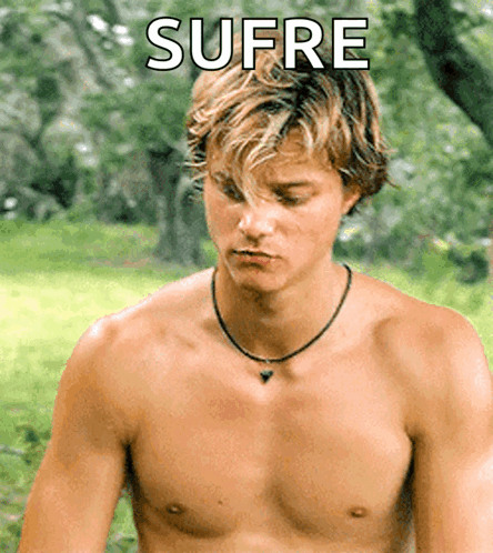 A Shirtless Man With The Word Sufre Written On The Bottom GIF